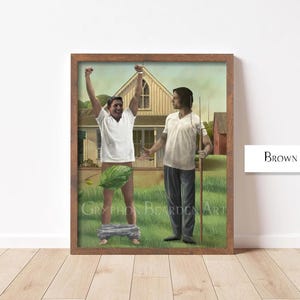May include: A framed artwork featuring two figures in a rural setting. One figure, wearing a white shirt, raises their arms. The other figure, in a white shirt and blue pants, holds a pitchfork. The artwork is in a brown frame.