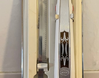 Cuchillo eléctrico vintage Sunbeam de mediados de siglo para colgar en la pared
