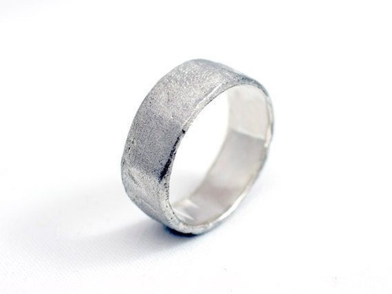 HARD ring made of Sterling Silver with grated diamond texture.