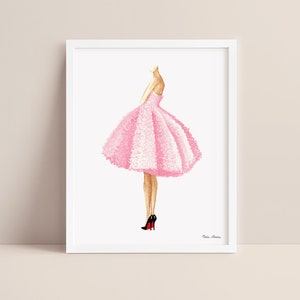 Pink dress fashion illustration displayed in a white picture frame on a neutral background.