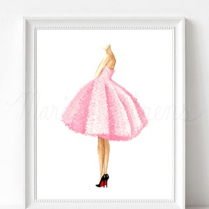 Pink dress watercolor fashion illustration displayed in white picture frame on a white background. Original artwork is by artist Maria Ahrens.