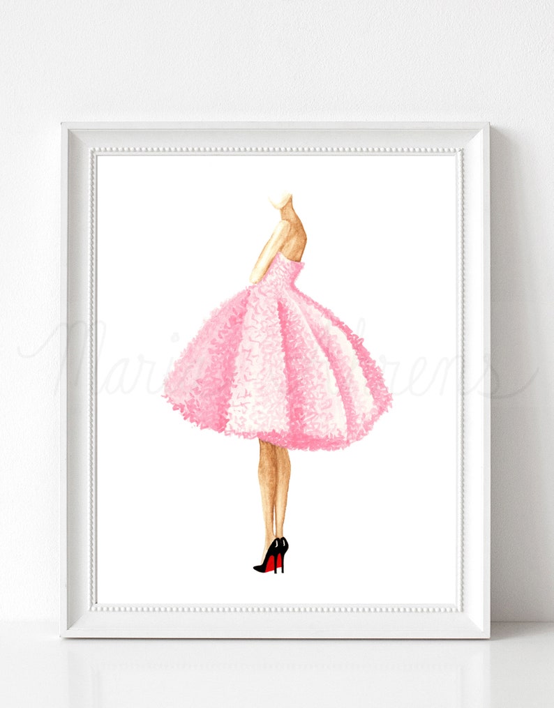 Pink dress watercolor fashion illustration displayed in white picture frame on a white background. Original artwork is by artist Maria Ahrens.