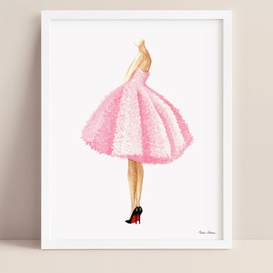 Pink dress fashion illustration displayed in a white picture frame on a neutral background.