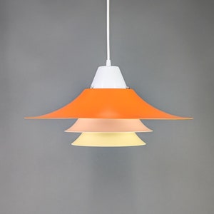 A Danish design lamp, orange and yellow colours, a vintage lamp, mid century modern shapes, 1980s lamp, Scandinavian lamp dining table.