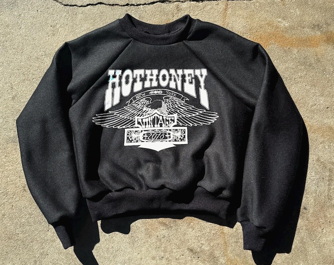 The “Hot Honey Eagle” Black Cropped Raglan Sweatshirt