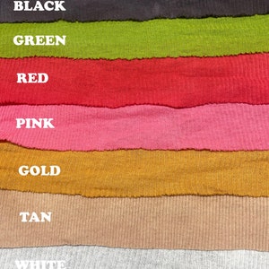 May include: A close-up of seven fabric swatches in different colors. The swatches are arranged vertically, with the top swatch being black, followed by green, red, pink, gold, tan, and white.
