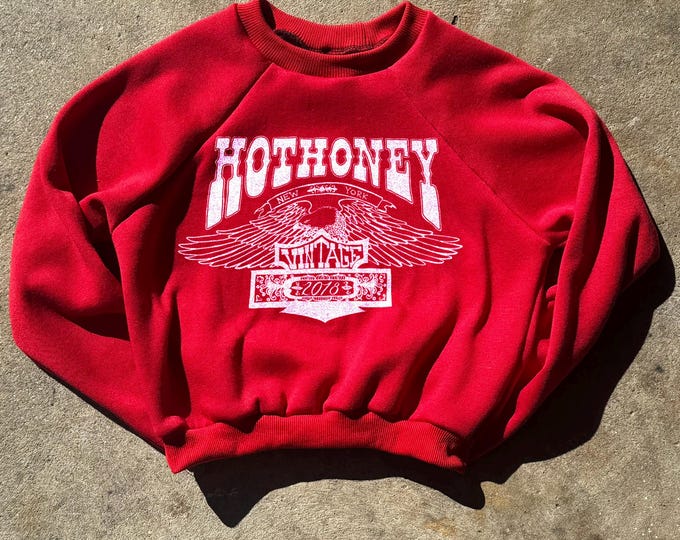 The “Hot Honey Eagle” Red Cropped Raglan Sweatshirt