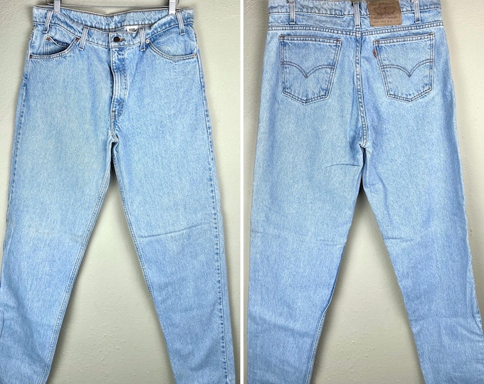 Vintage 1990 Lightwash Levi’s 550 Orange Tab Denim Waist 36"
