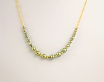 bohemian chic necklace with swarovski pearls imitating freshwater gems and a golden plated chain