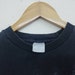 Vintage 00s purple skull and crossbones top