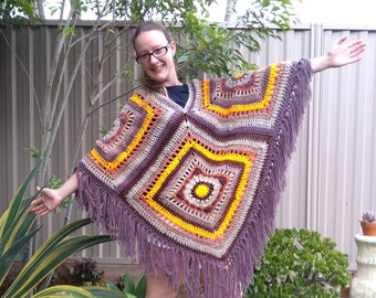 SALE ITEM.. 1 only...another fun poncho..lightweight earthy tones
