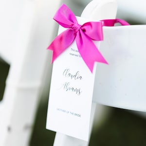 &quot;Hochzeitsfest &quot;&quot;Party reservierter Sitzplatz&quot;&quot;-Schild mit farbiger Schleife.&quot;