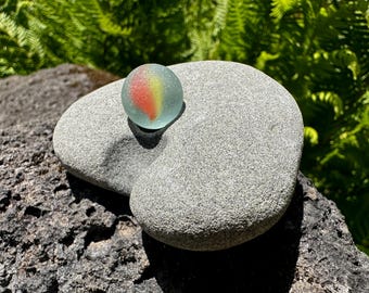 Cat's Eye Sea Glass Marble on Heart-Shaped Hagstone Stand -  Natural Beach Stone - Odin stone, adder stone, fairy stone, witch stone