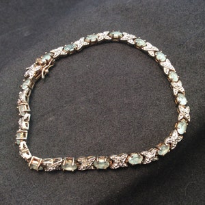 925 Sterling Silver HSN Ross Simons 4mm Tennis bracelet with 17 oval Blue Aquamarine Gemstones and 4 small diamonds