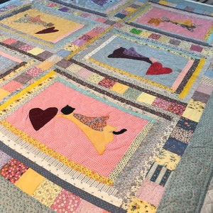 Flying cats with hearts lap quilt