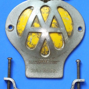 May include: A white ceramic mug with a black handle and the text "But First, Coffee" in a black, bold font. The mug is on a white surface.