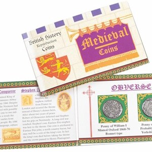 May include: A set of two silver medieval coins in a display case with a green background. The case has the text "OBVERSE" printed on the front. The coins are labeled "Penny of William 1 Minted Oxford 1068-70 Bonnet type" and "Penny of Eustace Probably minted in Yorkshire 1138-53".