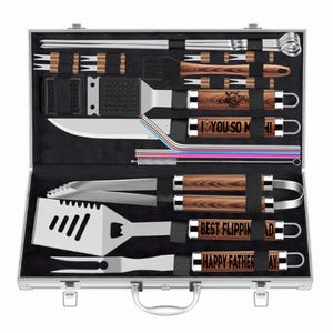 Bright studio mockup of personalized BBQ grill utensil set in aluminum case. Features wood-grain handles engraved with ‘Love You So Much!,’ ‘Best Flippin’ Dad,’ and ‘Happy Father’s Day.’ Custom engraved grill set gift for dad, Father’s Day, birthdays, or anniversaries, ideal for outdoor cooking enthusiasts.