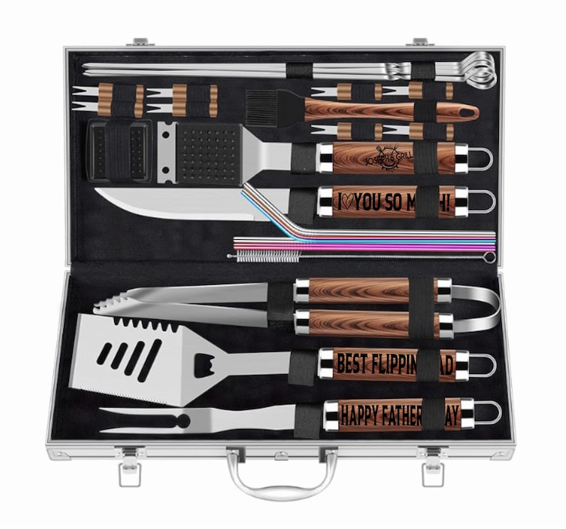 Bright studio mockup of personalized BBQ grill utensil set in aluminum case. Features wood-grain handles engraved with ‘Love You So Much!,’ ‘Best Flippin’ Dad,’ and ‘Happy Father’s Day.’ Custom engraved grill set gift for dad, Father’s Day, birthdays, or anniversaries, ideal for outdoor cooking enthusiasts.