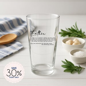 May include: A clear pint glass with the word "Father" and its definition printed in black. The definition includes the phrases "unlimited comedy and Dad jokes" and "loves unconditionally." A "Save 30% Today Only" sticker is in the lower left.