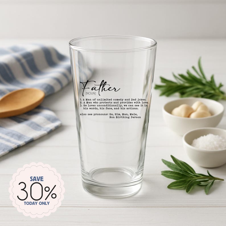 May include: A clear pint glass with the word "Father" and its definition printed in black. The definition includes the phrases "unlimited comedy and Dad jokes" and "loves unconditionally." A "Save 30% Today Only" sticker is in the lower left.