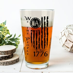 We the People Pint Glass | Black Engraved 1776 Patriotic Beer Mug | American Flag with Bullets Gift | Second Amendment Dad Glass