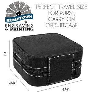 A compact black travel jewelry case with white stitching, featuring a secure zipper closure. The case measures 3.9 inches by 3.9 inches and is 2 inches in height, making it a perfect size for carrying in a purse, carry-on, or suitcase. The Hometown Engraving & Printing logo is displayed in the top left corner, highlighting its customization options.