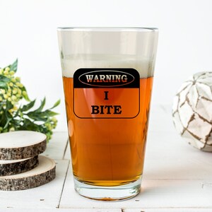 Warning I Bite Pint Glass | Black Engraved Funny Beer Glass | Edgy Gift for Him or Her | Sarcastic Barware | Bold Drinkware Cup
