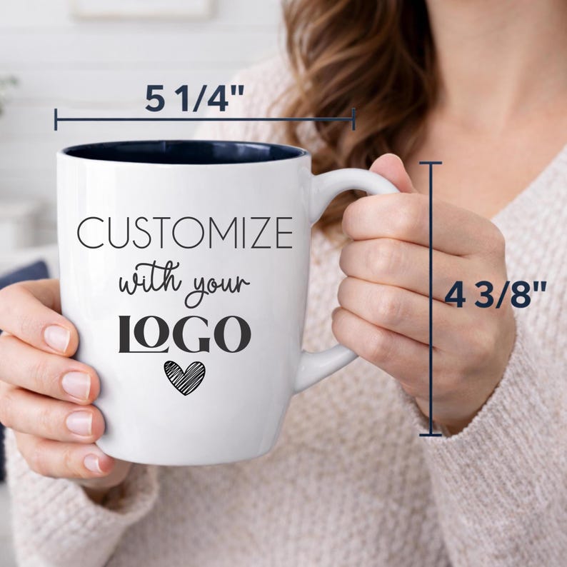 Personalized logo coffee mug with size details, 18 oz glossy white ceramic bistro cup with black interior, precision laser engraved for long-lasting customization. Measures 5 1/4 inches wide and 4 3/8 inches tall, offering a generous capacity for daily use. Ideal for company swag, promotional giveaways, trade shows, holiday corporate gifts, and branded office drinkware.