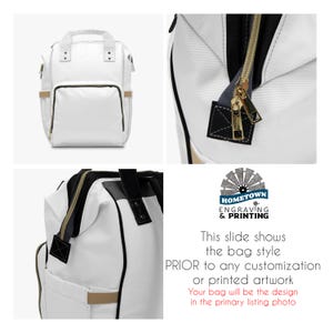 Informational image showing three angles of a blank white diaper bag backpack before customization. Includes front view, side view, and close-up of gold zippers and black stitching. A logo for "Hometown Engraving & Printing" appears above a note explaining the bag style shown is the base model before any printed design. Text states that the customer’s final product will match the primary listing image.