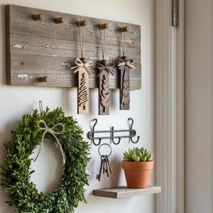 Rustic farmhouse entryway with wooden Christmas ornaments hanging beside wreath.