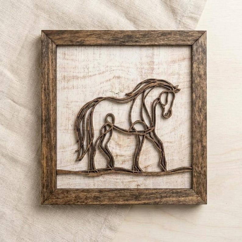 May include: Wooden framed wall art featuring a horse silhouette. The horse is crafted from dark brown wood, set against a distressed white background. The frame is a complementary dark brown. A rustic, equestrian-themed home decor piece.