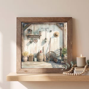 May include: A square watercolor painting in a dark brown wooden frame depicting a rustic interior with white vertical wooden walls. The scene features a wooden barrel, a broom, a straw hat, a lantern, and various containers arranged on a floor.