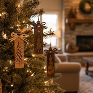 Assorted rustic Christmas tree ornaments in neutral wood stains with raffia bows.
