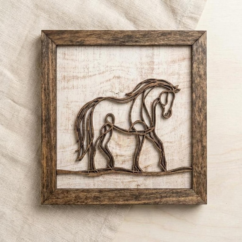 May include: Wooden framed wall art featuring a horse silhouette. The horse is crafted from dark brown wood, set against a distressed white background. The frame is a complementary dark brown. A rustic, equestrian-themed home decor piece.