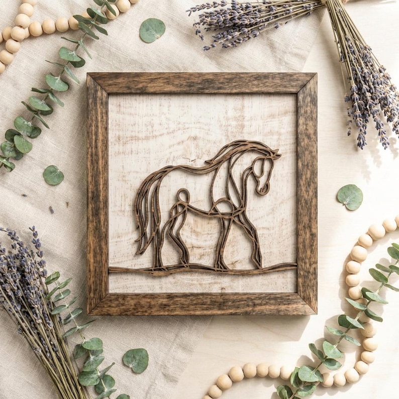 May include: A wooden framed art piece featuring a horse silhouette. The horse is crafted from thin, brown wood strips, set against a light-colored wooden background. The frame is a darker brown with a wood grain pattern. The artwork is surrounded by decorative elements.