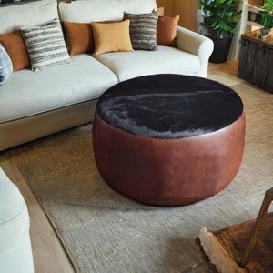 Round Brown and Black Leather Ottoman