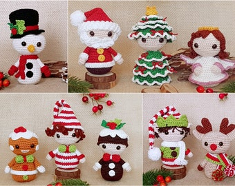 May include: A collection of handmade crocheted Christmas decorations, including a snowman, Santa Claus, a Christmas tree, an angel, a gingerbread person, a Christmas pudding, an elf, and a reindeer. The decorations are all made with colourful yarn and have cute faces.