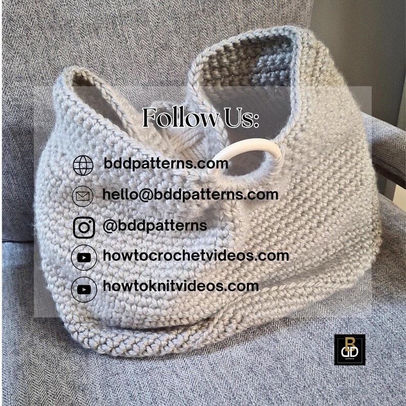 May include: A light gray, hand-knitted bag with a white handle. The bag is made of thick yarn and has a textured appearance. The text "Follow Us:" is visible, along with website and social media information.