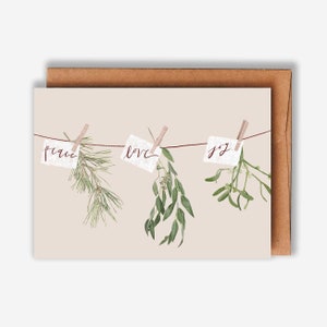 Tarjeta navideña con motivos de paz, amor y alegría / Ilustración/dibujo con decoración de vegetación