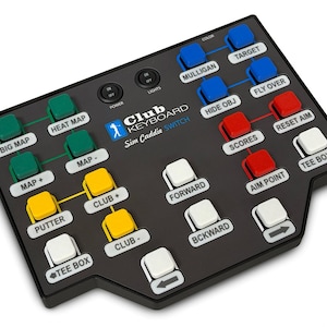 May include: A black Club Keyboard Sim Caddie Switch controller featuring a grid of colored buttons labeled with golf simulation functions like Big Map, Heat Map, Mulligan, Target, Scores, Aim Point, Tee Box, Forward, Backward, Club +, and Club -.