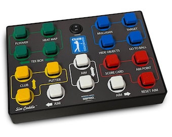 May include: A black rectangular golf simulator keyboard controller with a grid of colored buttons. It features green, yellow, white, blue, and red buttons labeled with functions like Flyover, Heat Map, Mulligan, Target, Club, Putter, and Aim.