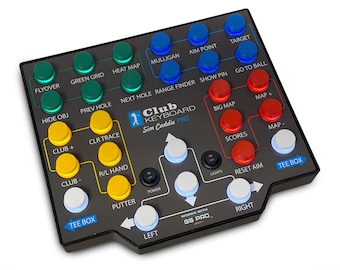May include: A black Club Keyboard Sim Caddie Pro controller featuring a grid of colorful buttons labeled with golf simulation functions including Flyover, Green Grid, Heat Map, Mulligan, Aim Point, Target, Big Map, Scores, and Tee Box.