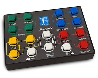 May include: A rectangular black control console for golf simulation software featuring a grid of colored buttons labeled with functions like Flyover, Heat Map, Mulligan, Target, Hide Objects, Go To Ball, Score Card, Aim Point, Club, Putter, and Aim.