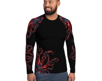Può includere: Maglietta nera a maniche lunghe con un design di polpo rosso e nero sulle maniche. La maglietta ha un collo rotondo e uno stile aderente.