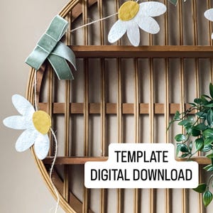 May include: A daisy garland with white petals and yellow centers hangs in front of a round, wooden shelf. Green bows accent the garland. The text "TEMPLATE DIGITAL DOWNLOAD" is in a white box.
