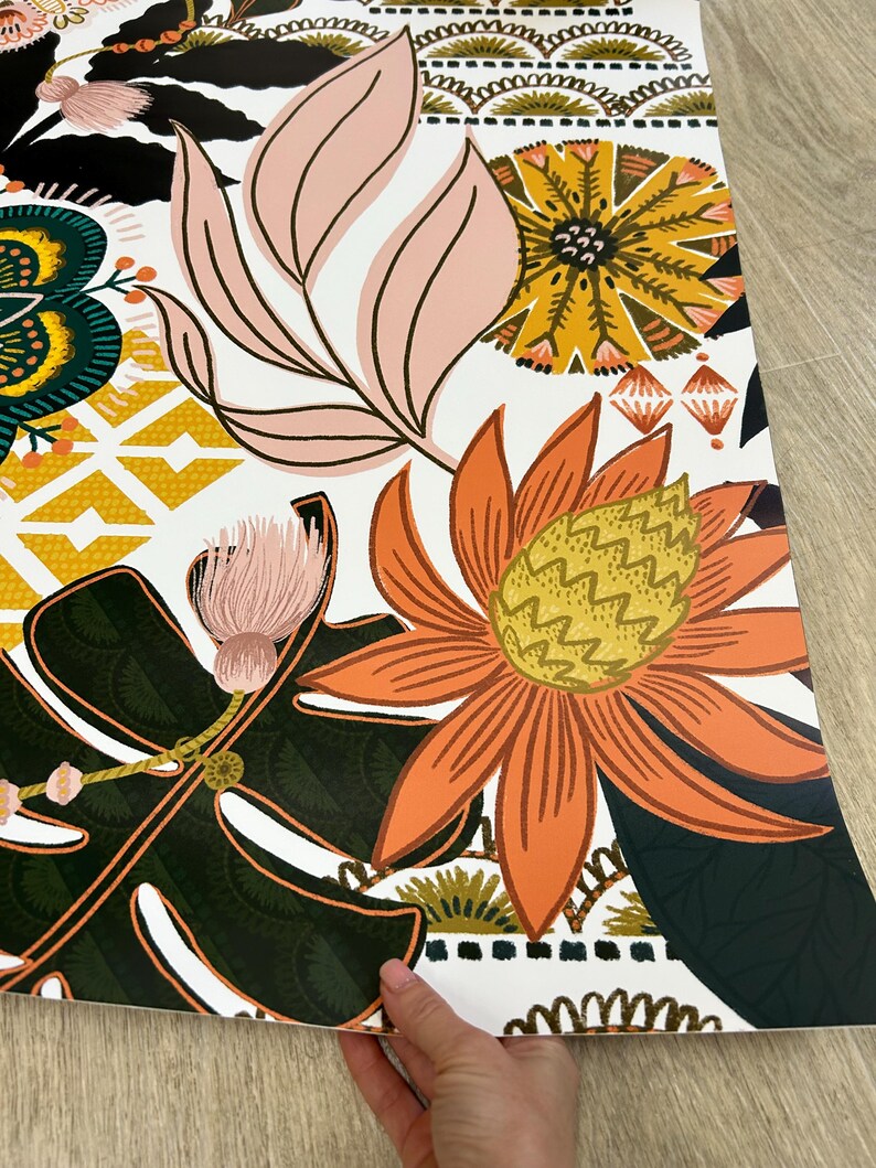 A white fridge wrap with a colorful floral pattern. The pattern includes pink, orange, yellow, green, and black flowers and leaves.