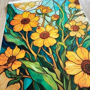 May include: A stained glass style illustration of a bouquet of yellow flowers with green leaves against a blue background.