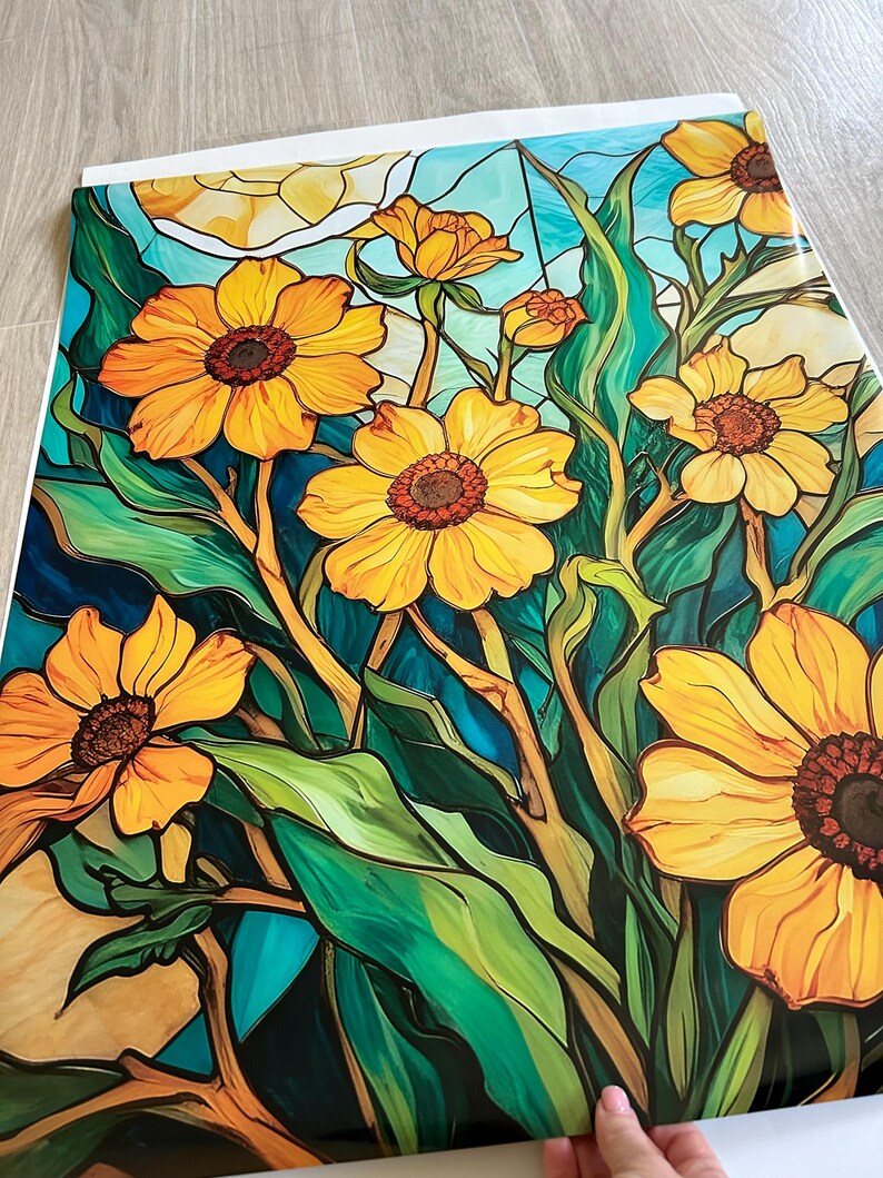 May include: A stained glass style illustration of a bouquet of yellow flowers with green leaves against a blue background.