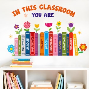 May include: A wall decal featuring the text IN THIS CLASSROOM YOU ARE above a row of colorful book spines labeled with positive words like BE KIND, TRUSTED, UNIQUE, IMPORTANT, SMART, SPECIAL, RESPECTED, SMILE BIG, LOVED, AMAZING, and CREATORS.